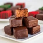 square image of stacked candies on a white square plate