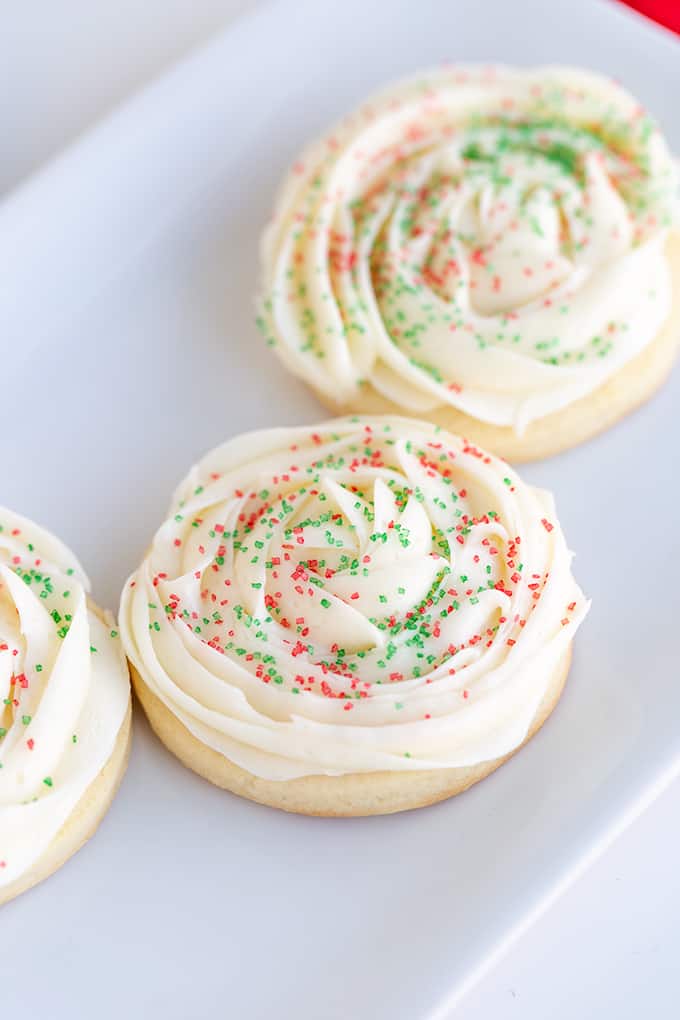 frosted cookies on a white platter