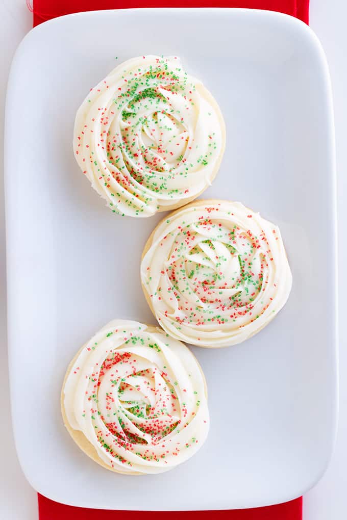 overhead image of 3 sugar cookies on a white plate