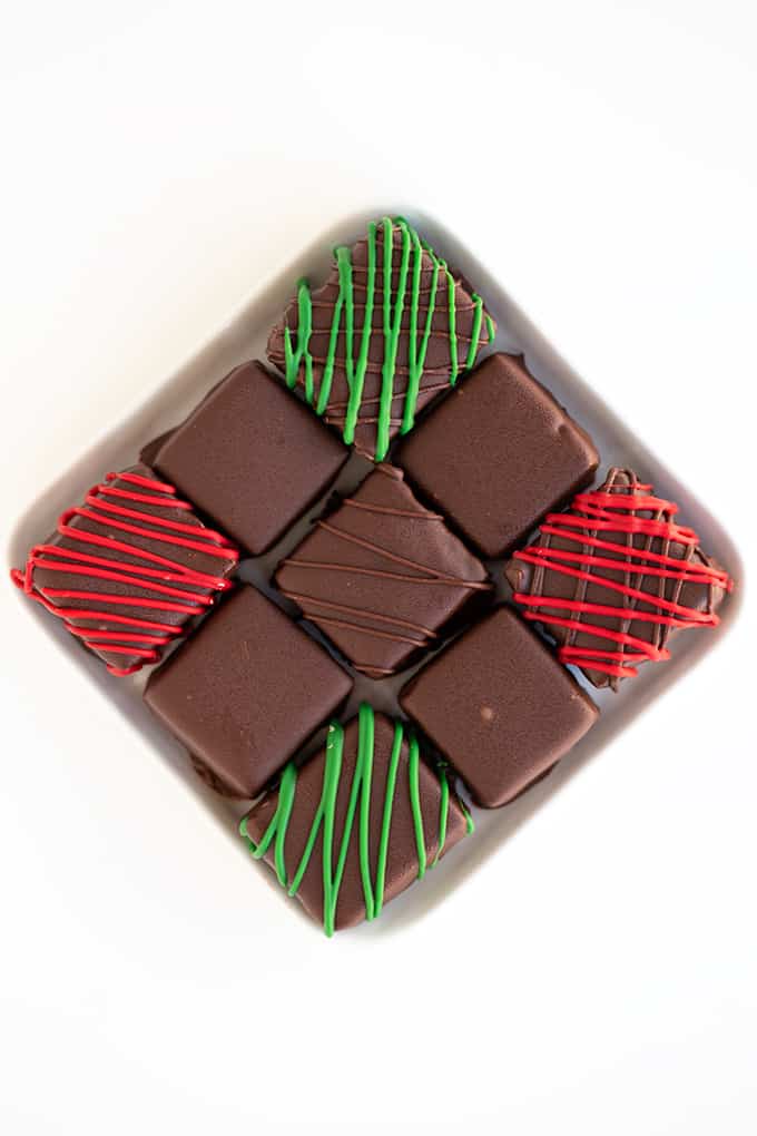 overhead image of a square plate with 9 cool whip candies on a white surface