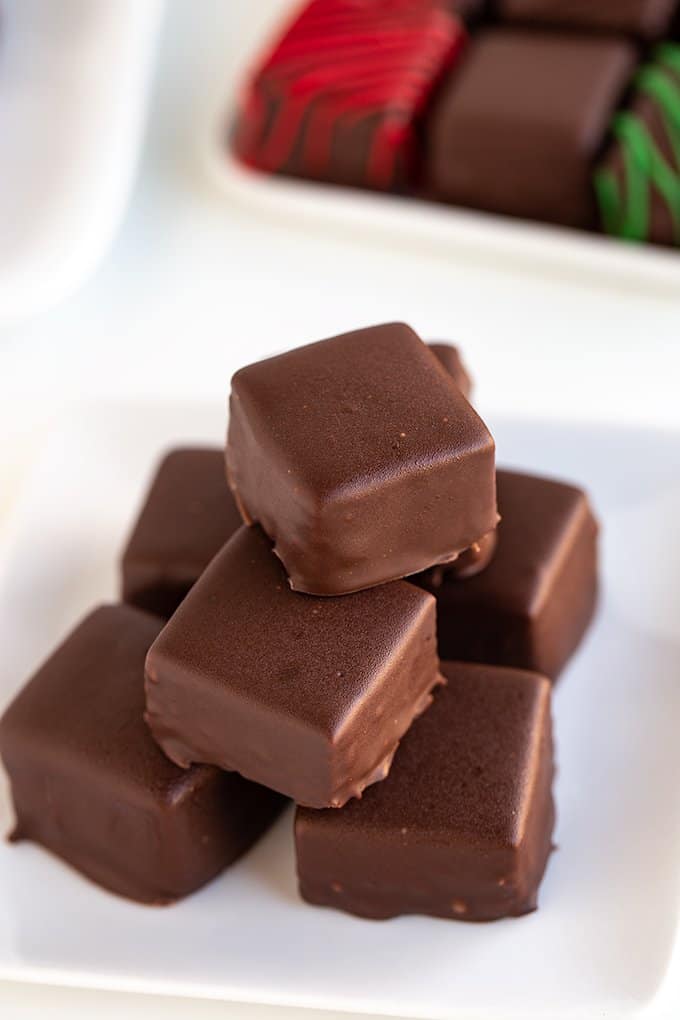 candies on a small white plate on a white surface