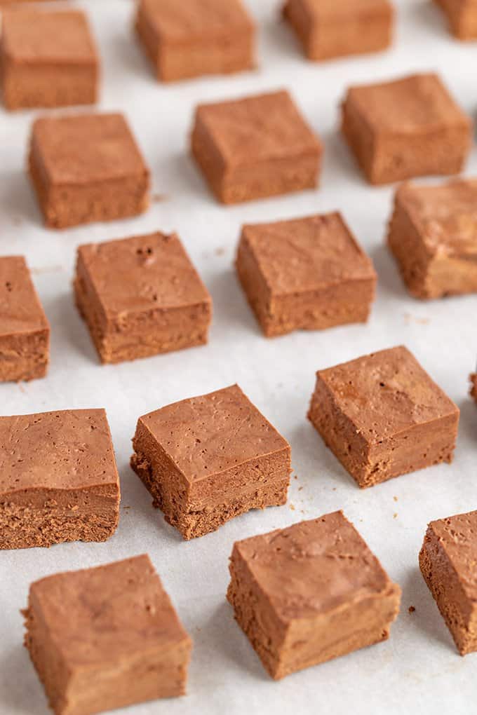 showing the small squares of candy on a parchment paper