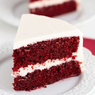 slice of cake on a white lace plate