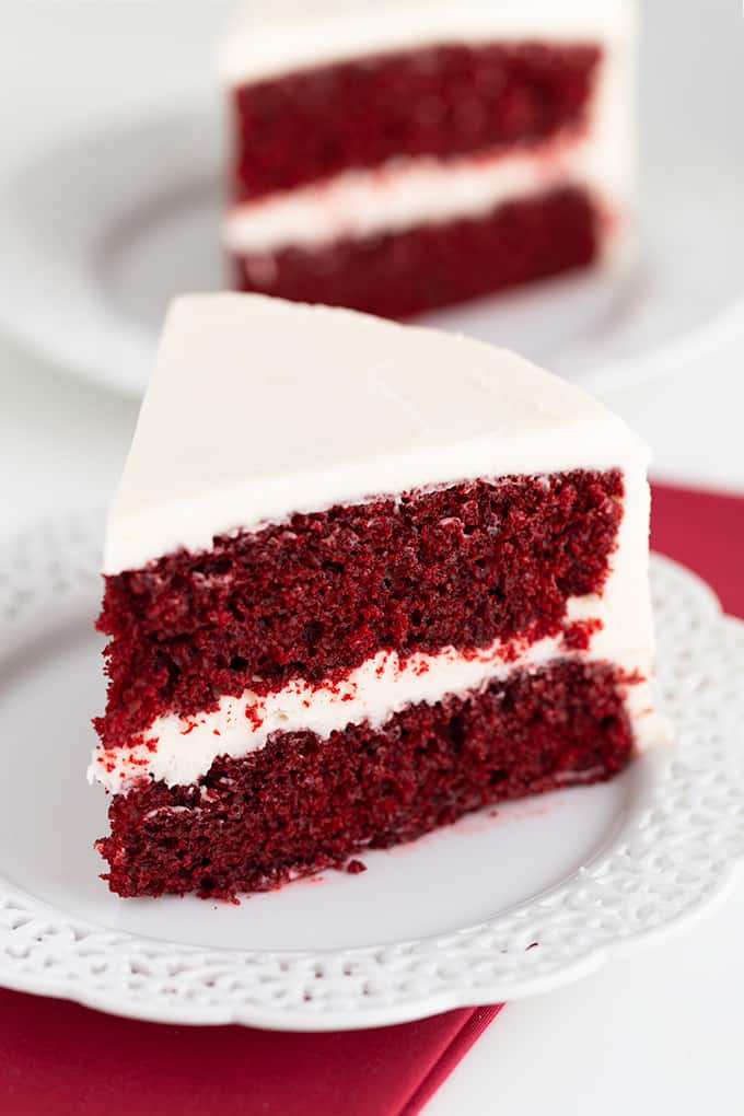 slice of cake on a white lace plate