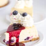 A slice of blueberry cheesecake on a plate.
