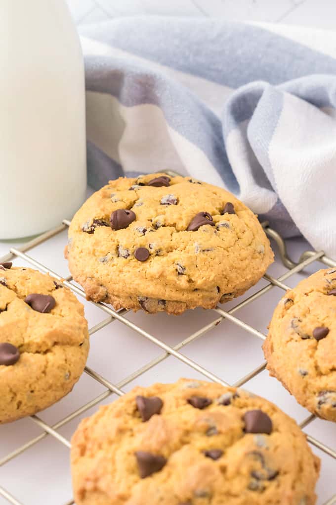 Cream cheese chocolate chip cookies on a cooling rack.