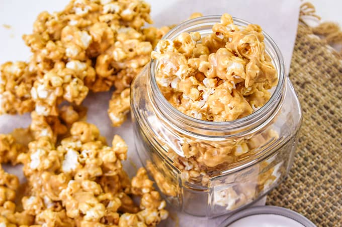 beautiful picture of in focus peanut butter popcorn in a jar.