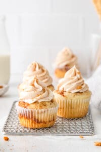 close up of cinnamon swirl cupcakes on a wire rack