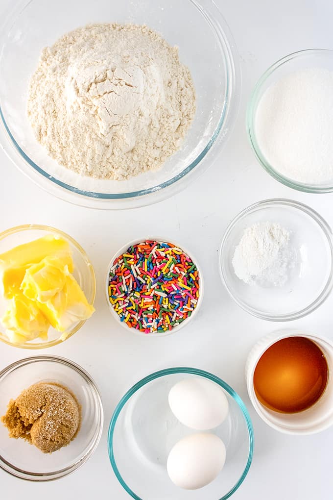 ingredients in glass bowls on a white surface