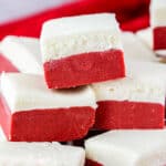 red velvet fudge stacked with a red linen behind it