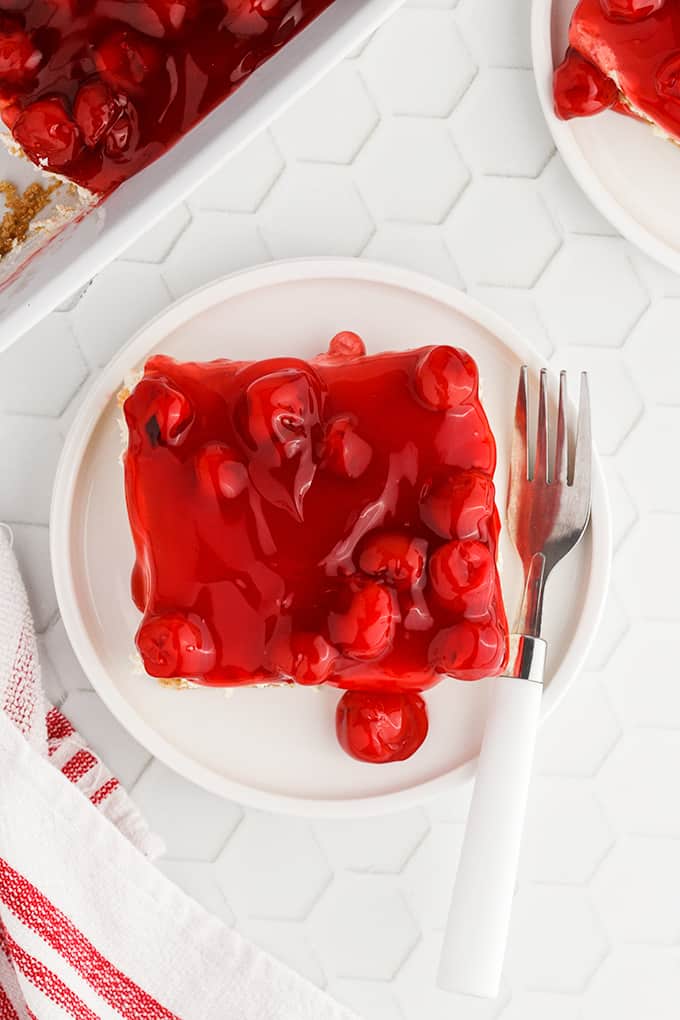 Single slice of cherry delight on a plate.