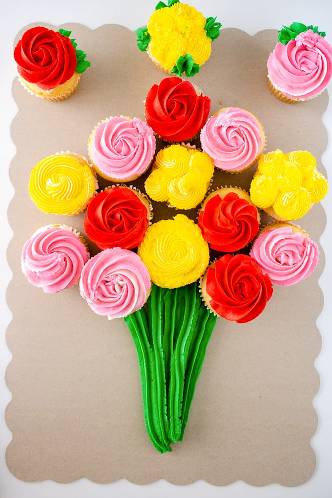 Finished cupcake bouquet on a cake board.