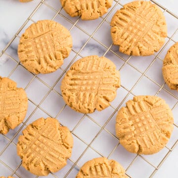 Peanut butter cookies made with cake mix on a cooling rack.