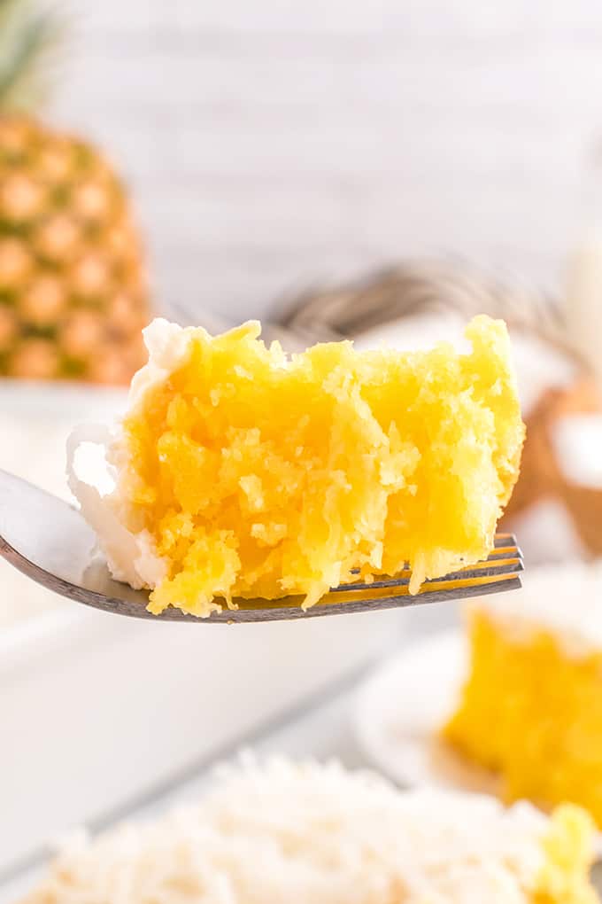 single close up bite of pineapple cake on a fork.