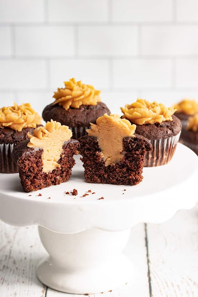 Cut away view of the chocolate zucchini cupcakes showing the inside of the cupcakes and the peanut butter filling.