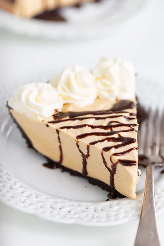 A delectable dessert consisting of a slice of peanut butter pie delicately placed on a plate.
