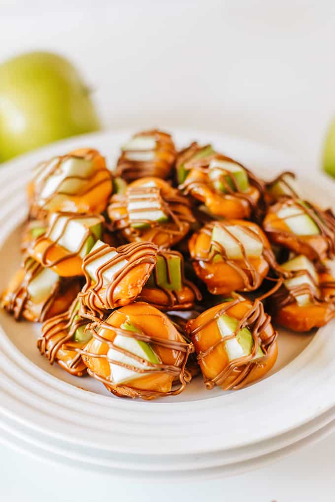 A plate of Caramel Apple Bites with pretzels on a white plate.