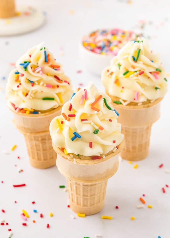 Ice cream cones with sprinkles on top are transformed into delightful cupcake-shaped treats.
