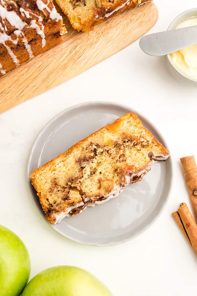A slice of apple cinnamon bread on a plate.