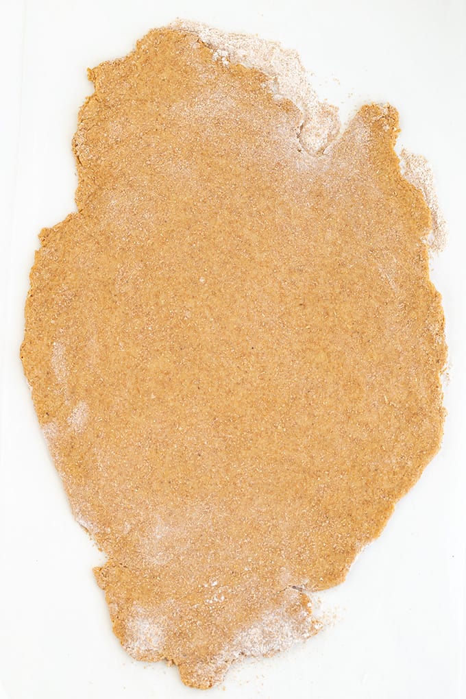 A piece of brown dough on a white surface.