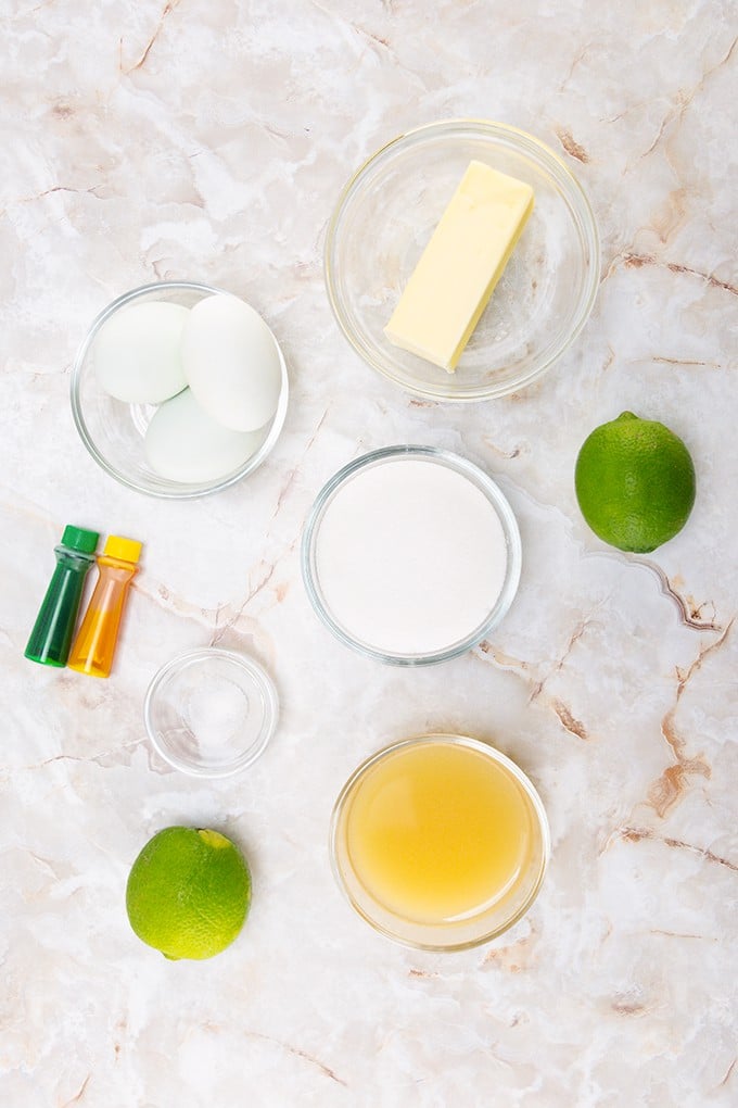 Lime Slime cupcakes are displayed on a marble table.