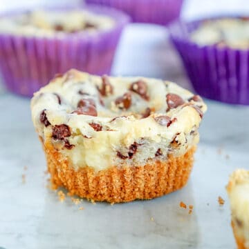 Mini chocolate chip cheesecakes on a plate.