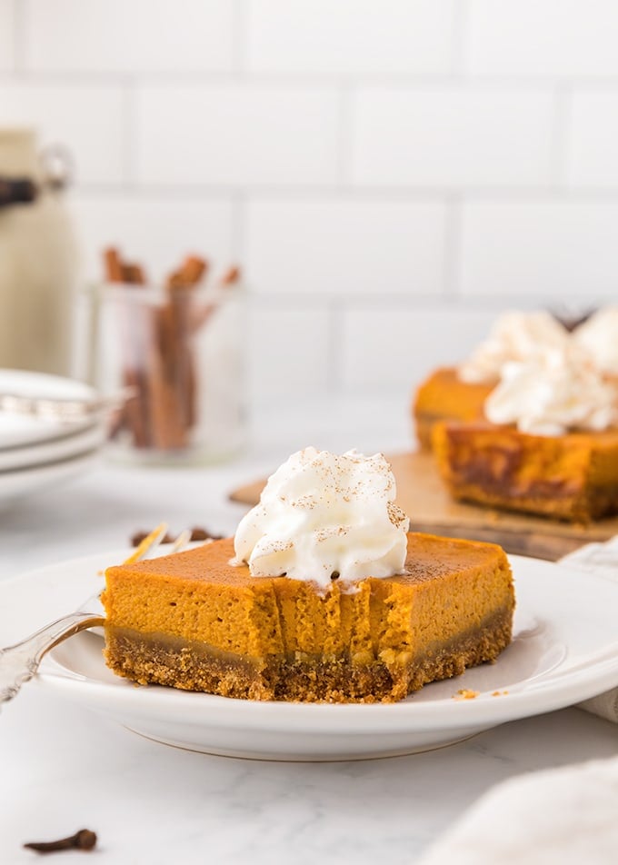 A slice of pumpkin pie on a plate.