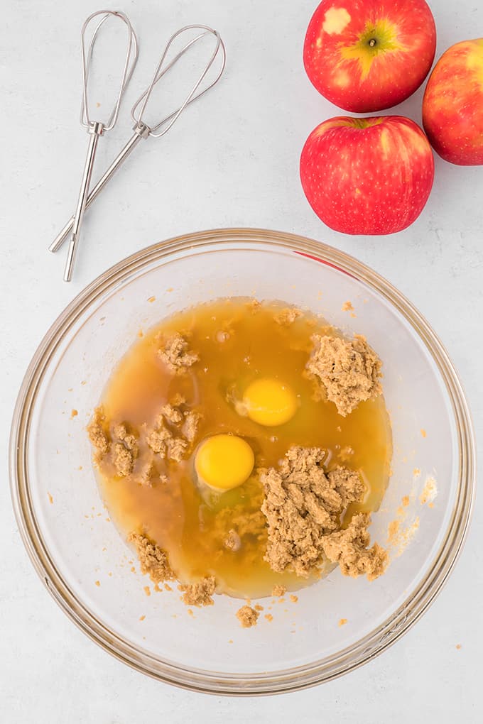 A bowl with eggs next to it.