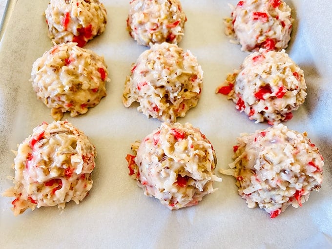 A tray of Martha Washington Candy cookies with red and white sprinkles on it.