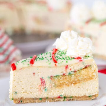 A slice of Little Debbie Christmas Tree Cheesecake on a plate.