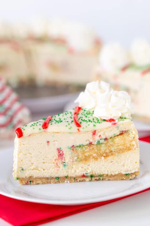 A slice of Little Debbie Christmas Tree Cheesecake on a plate.