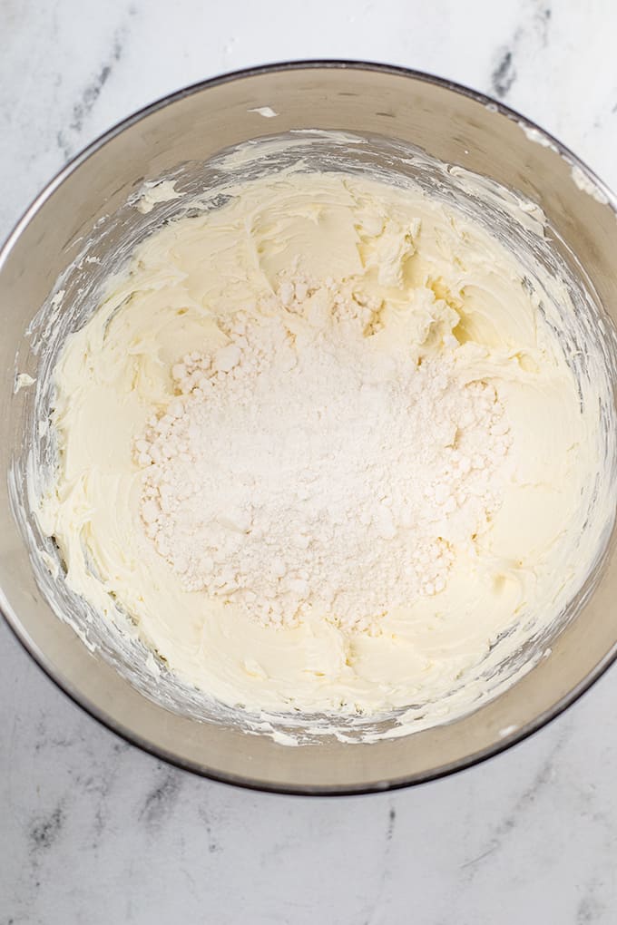 A Christmas truffle recipe, with butter melting in a mixing bowl on a beautiful marble countertop.