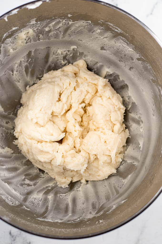 A bowl of Christmas truffle dough in a mixing bowl.