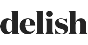 A black and white logo with the word delish.