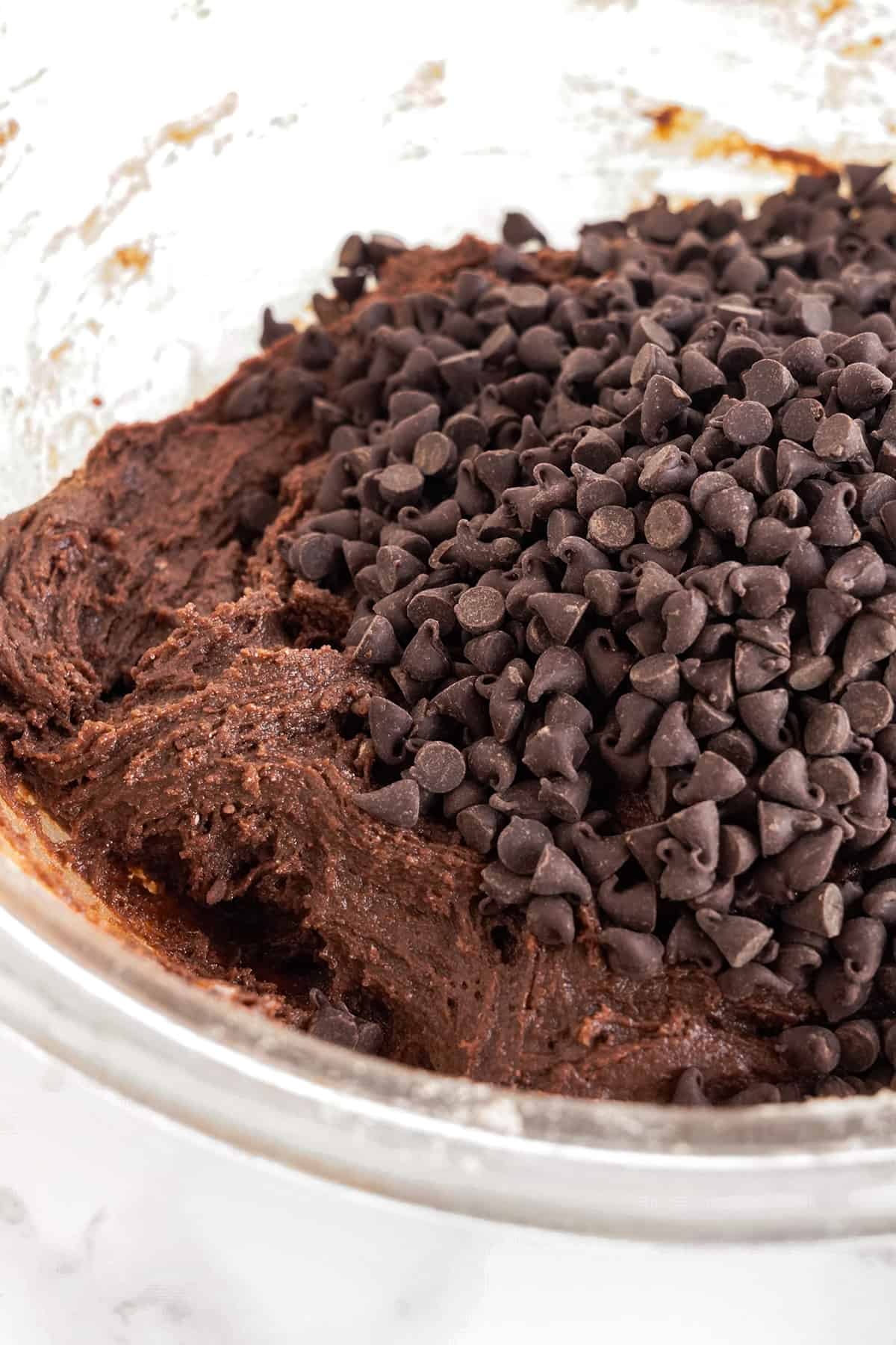 Brownie mix cookies in a bowl with chocolate chips.