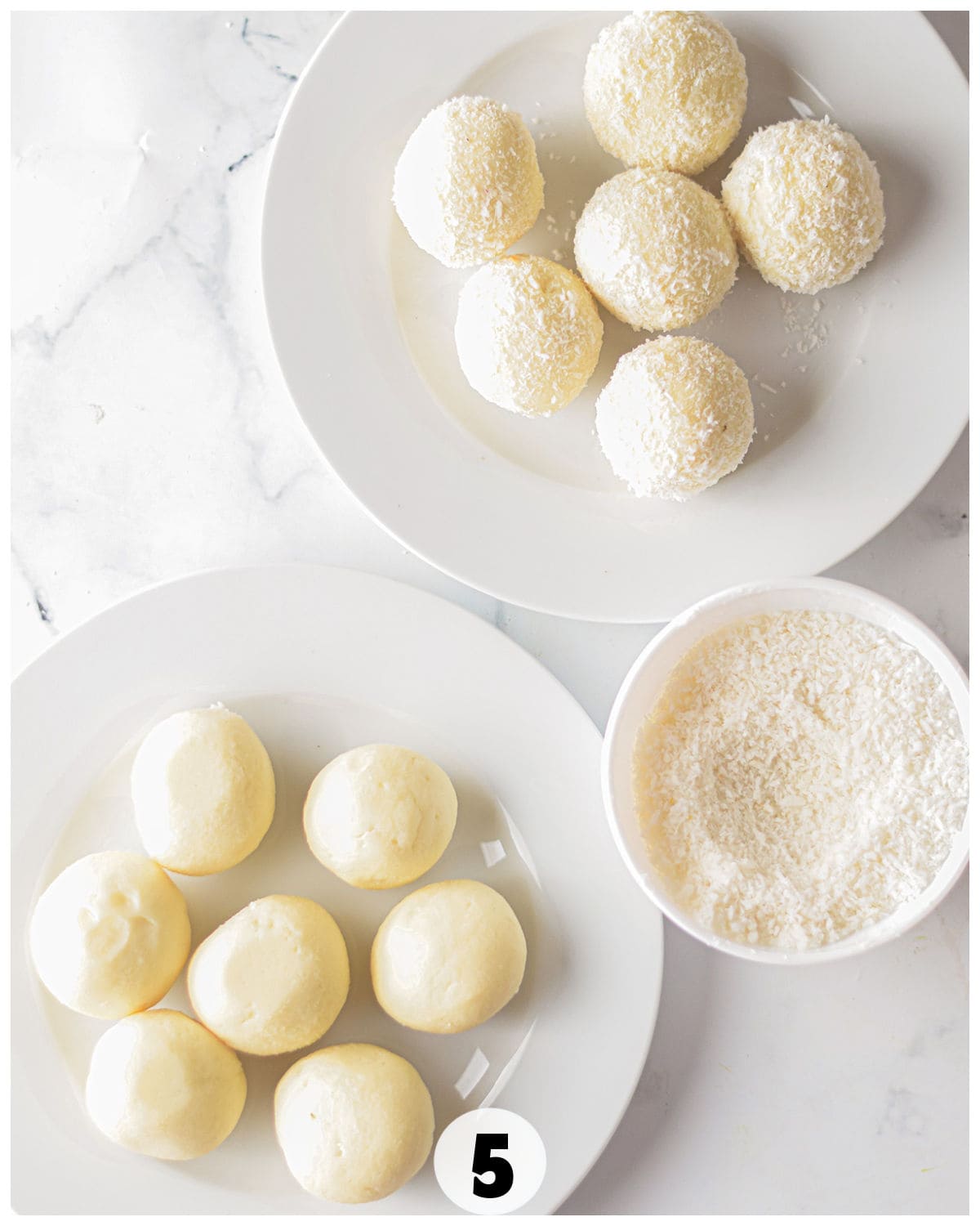 Two plates of round, white truffles rest on a marble surface. The top plate features coconut-covered delights, while the bottom holds plain ones. A bowl of shredded coconut sits nearby, ready to enhance these creamy, white chocolate-inspired treats.