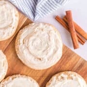 Honey Bun Cookies with sweet frosting are arranged on a wooden board.