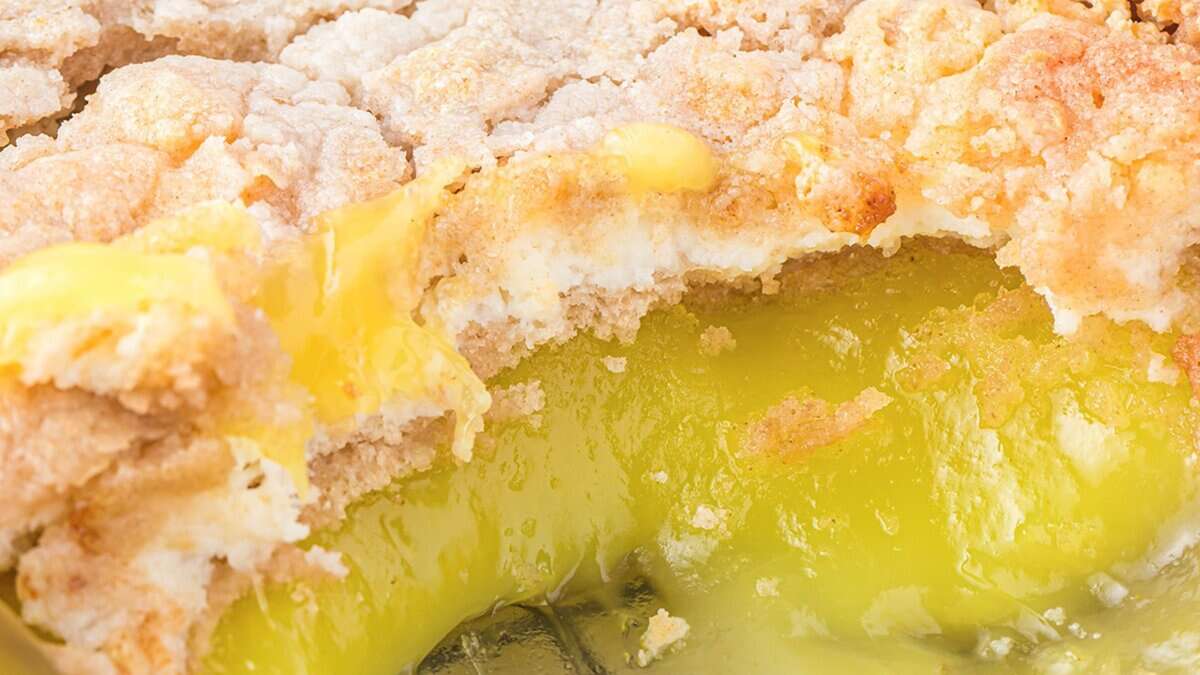 Close-up of a partially eaten lemon pie with a crumbly, golden crust and bright yellow, creamy filling&mdash;one of those easy desserts perfect for stress-free desserts lovers.