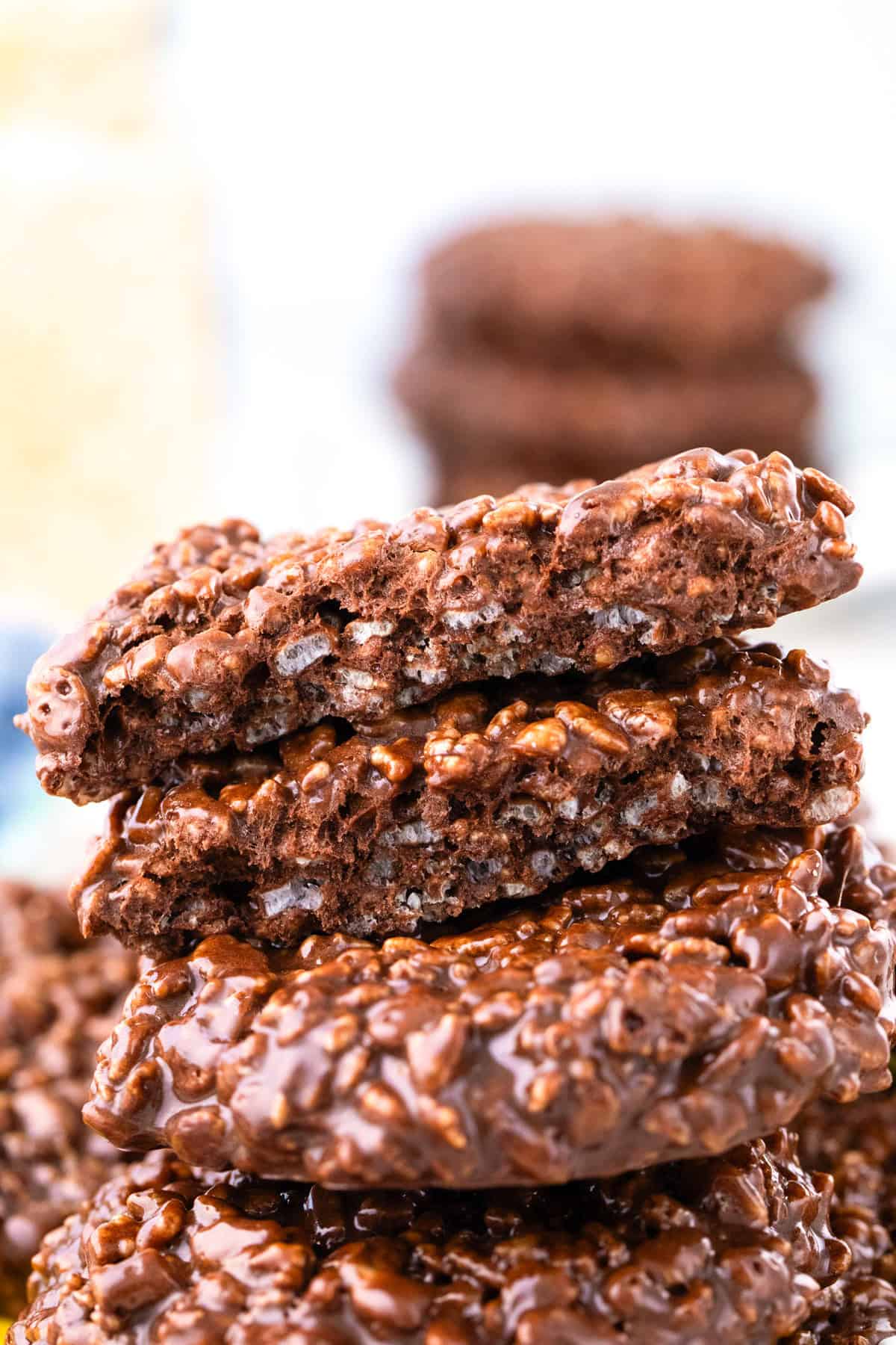 A close-up of a stack of Star Crunch Cookies, with the top two cookies partially broken to show their textured interior.